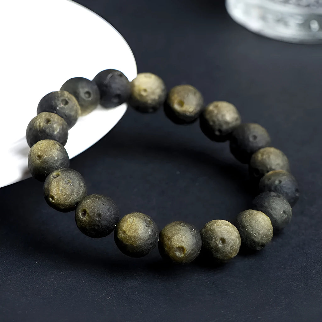 Obsidian crater ball bracelet with textured beads in silver stone or golden meteorite finish
