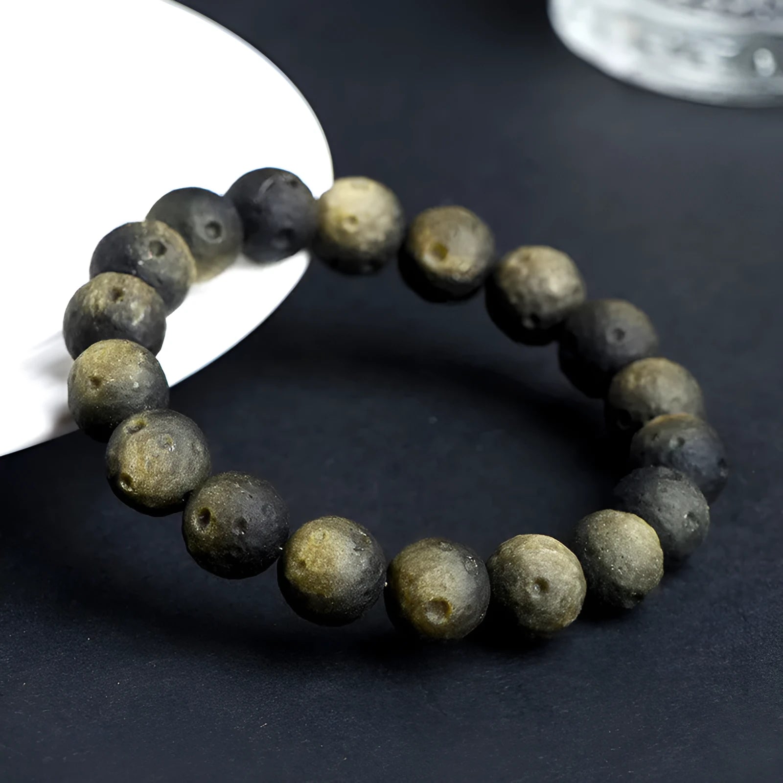 Obsidian crater ball bracelet with textured beads in silver stone or golden meteorite finish