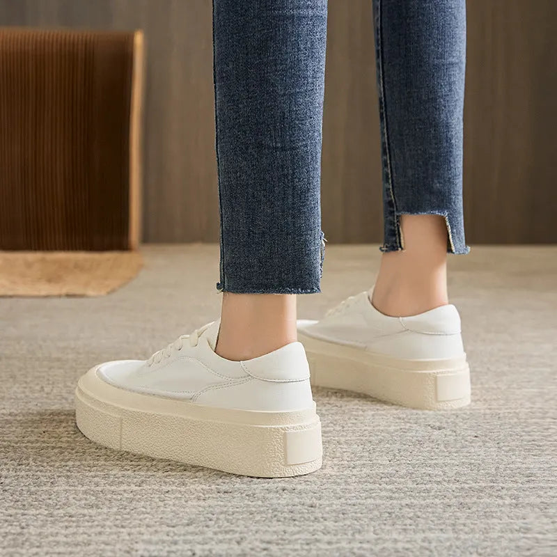 Women's black platform casual sports shoes with embossed cowhide upper and round toe design