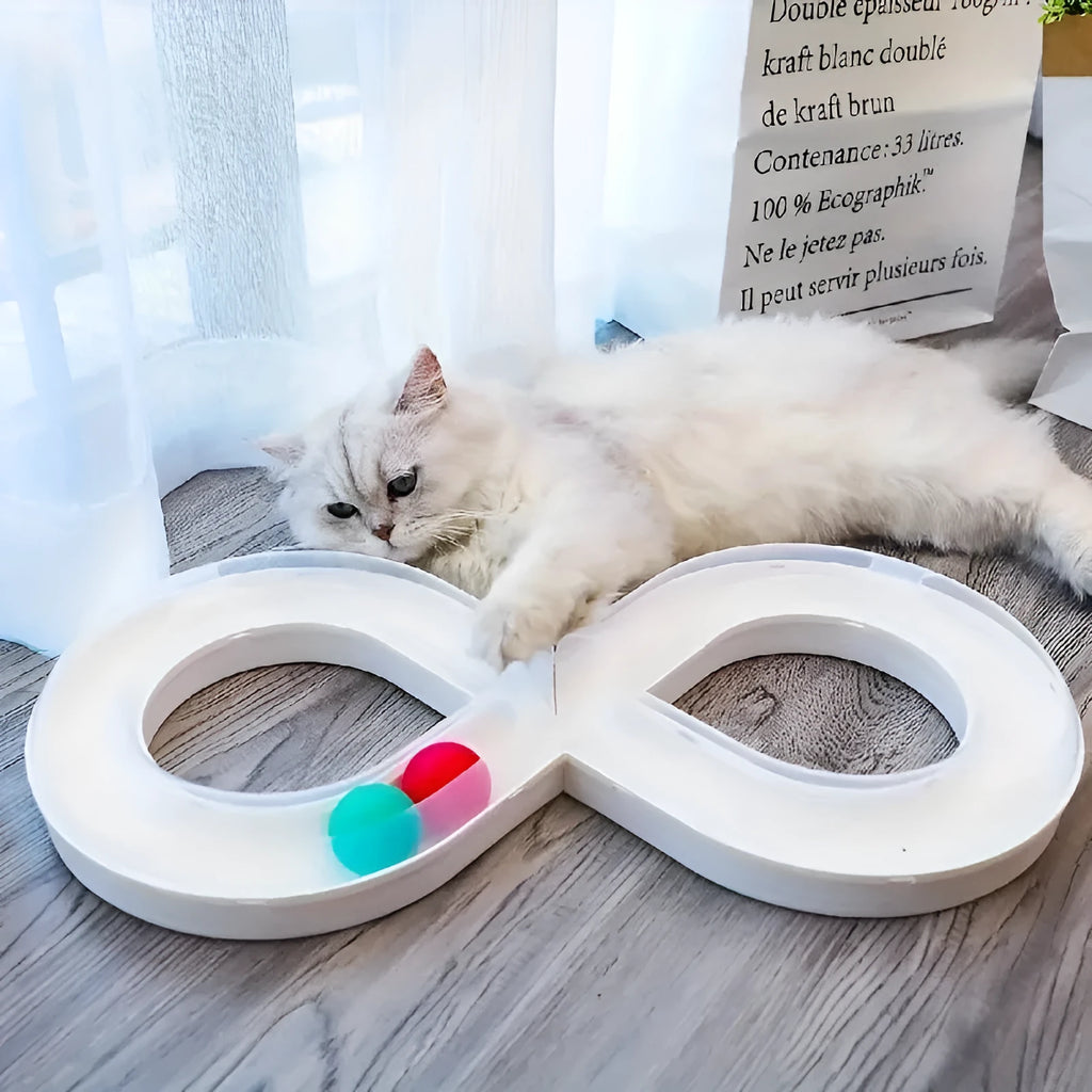Blue and white circular cat turntable track with four spinning balls and teasing stick for feline play