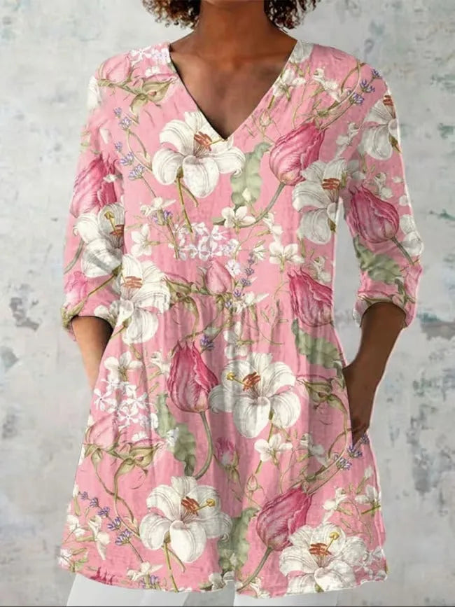 Women's slim-fit retro printed long-sleeved polyester top on a hanger, showing detail of digital print.