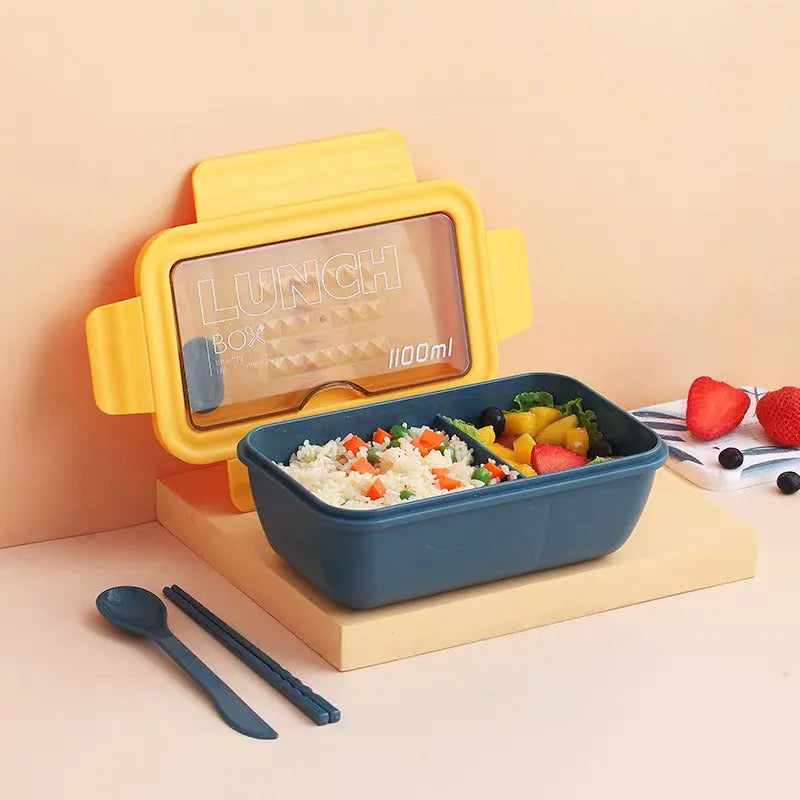 Green partitioned Japanese bento lunch box with four compartments showing dimensions