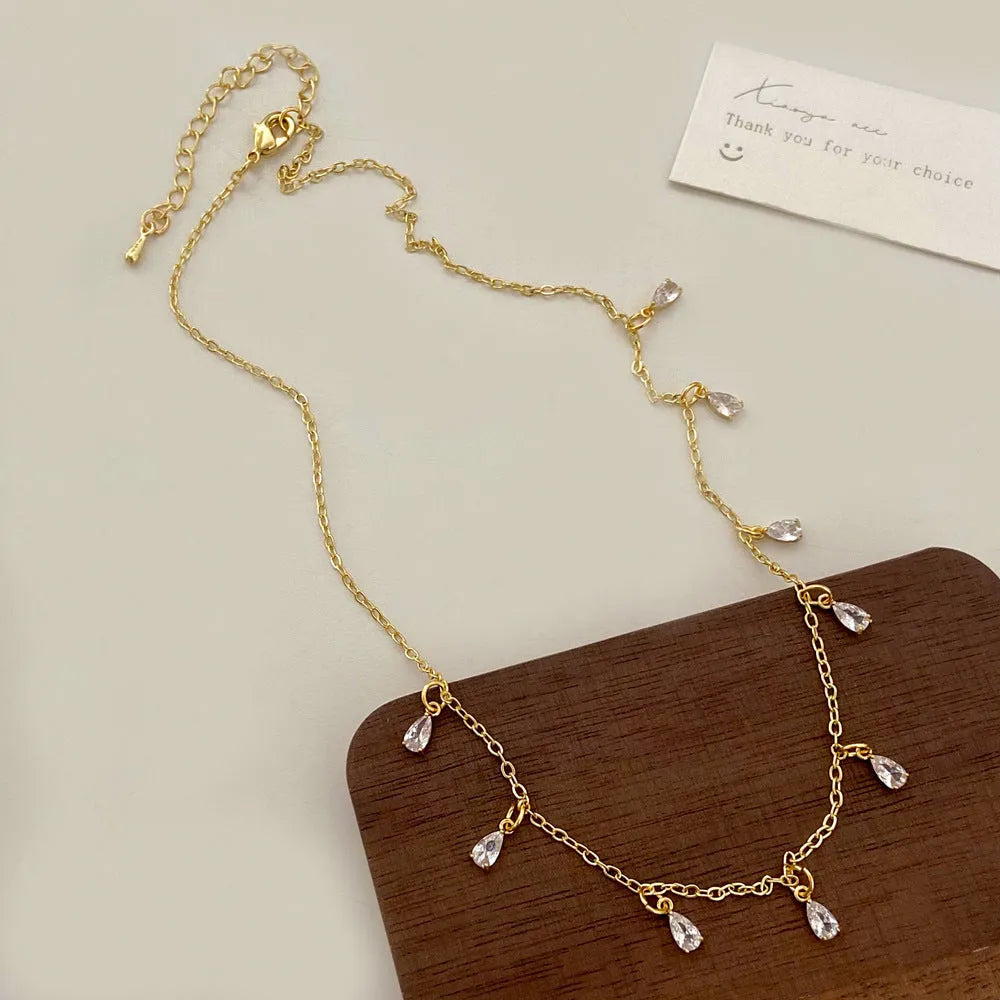 Women's zircon necklace set with matching geometric earrings and anklet featuring meteor shower pattern