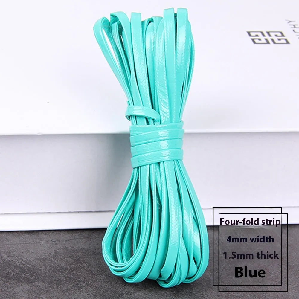 Coils of PU leather craft cord in multiple colours including black, red, blue, and beige