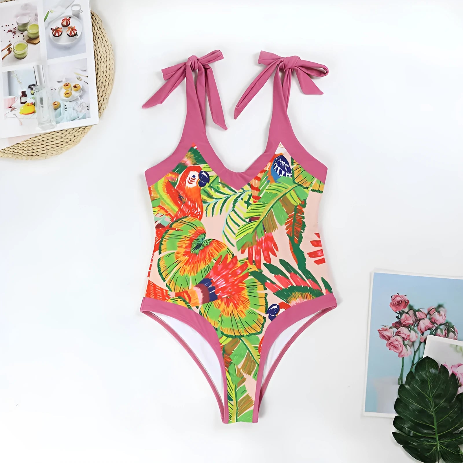 Women's pink floral print one-piece swimsuit with V-neck, covered belly, and attached skirt for swimming