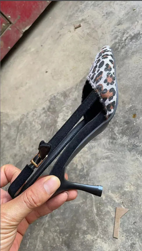 Women's leopard print suede pointed toe high-heel sandals with an adjustable ankle strap.