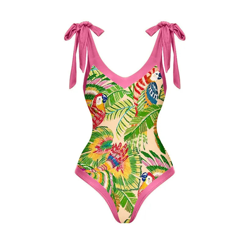 Women's pink floral print one-piece swimsuit with V-neck, covered belly, and attached skirt for swimming