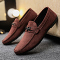 Men's waterproof black slip-on loafers with round toe and low stiletto heel on a rubber sole.