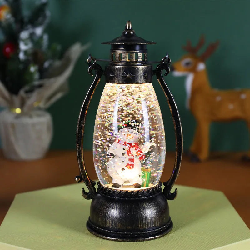 Portable crystal ball oil lamp Christmas ornament showing light-emitting snowman or elderly figure design on a desk.