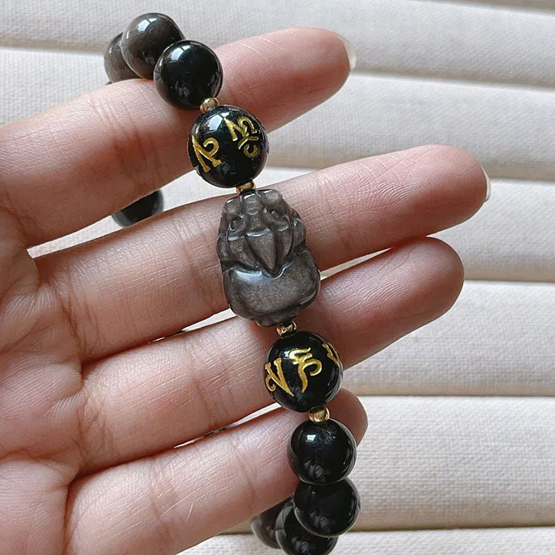 Men's silver stone bracelet with engraved zodiac and proverb designs on beaded surface