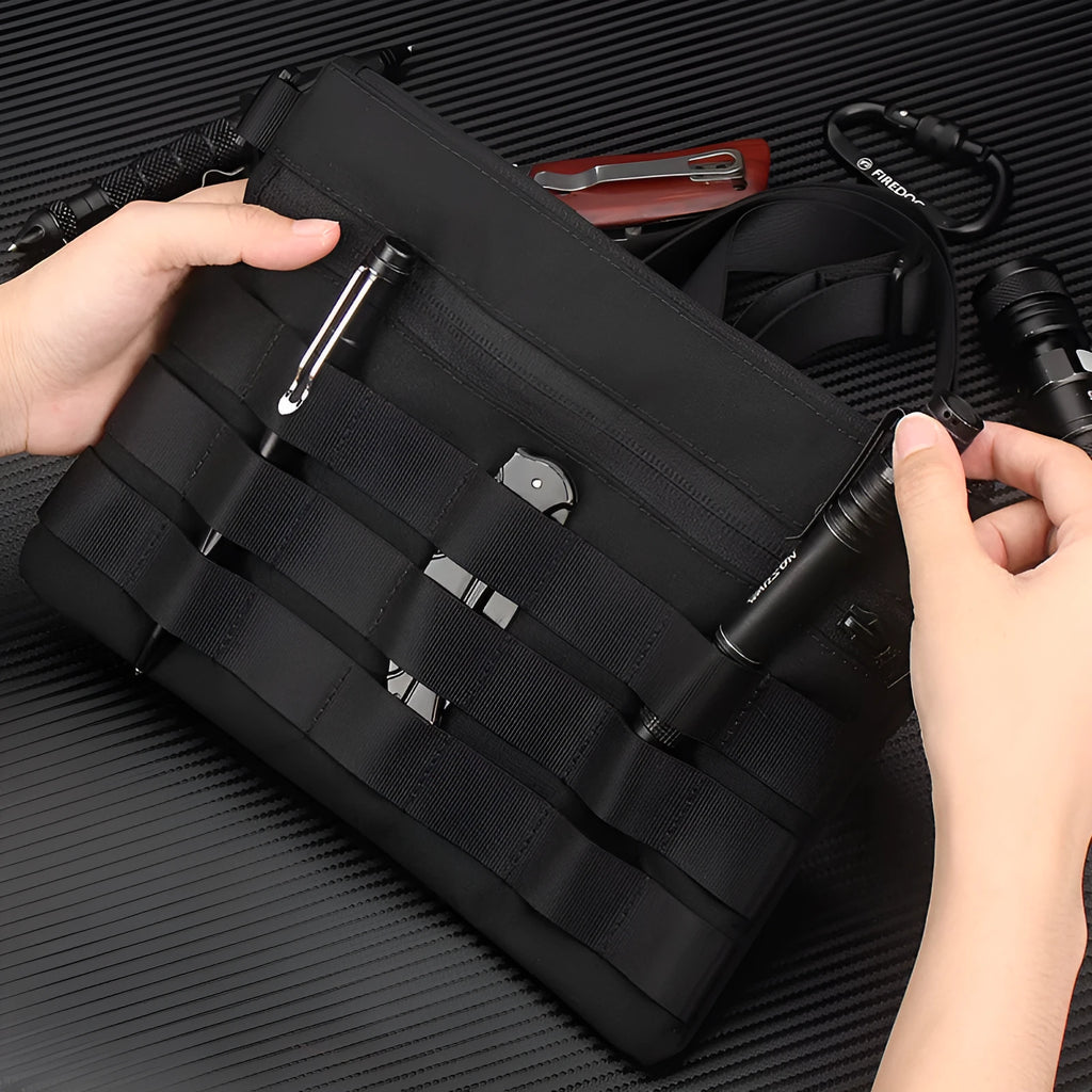 Black Oxford cloth outdoor organiser pouch with compact size for gear organisation.