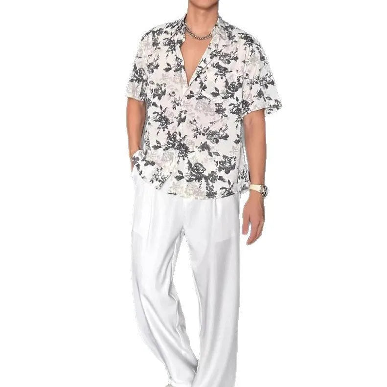 Loose casual short sleeve shirt with floral printed pattern and V-neck design in white colour
