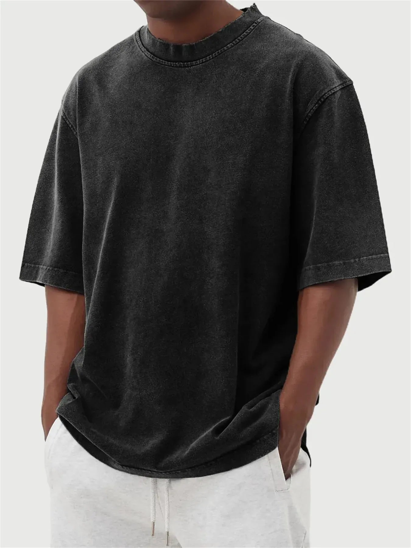 Men's distressed stone wash pullover T-shirt in loose fit with half sleeves available in multiple solid colours