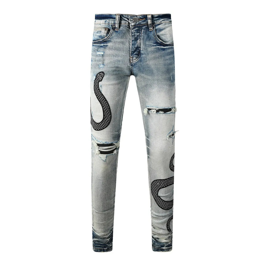 Blue distressed skinny jeans with a mid-waist and button-fly opening on a neutral background.