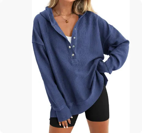 Women's loose fit raglan sleeve sweater in peacock green, shown on a model.