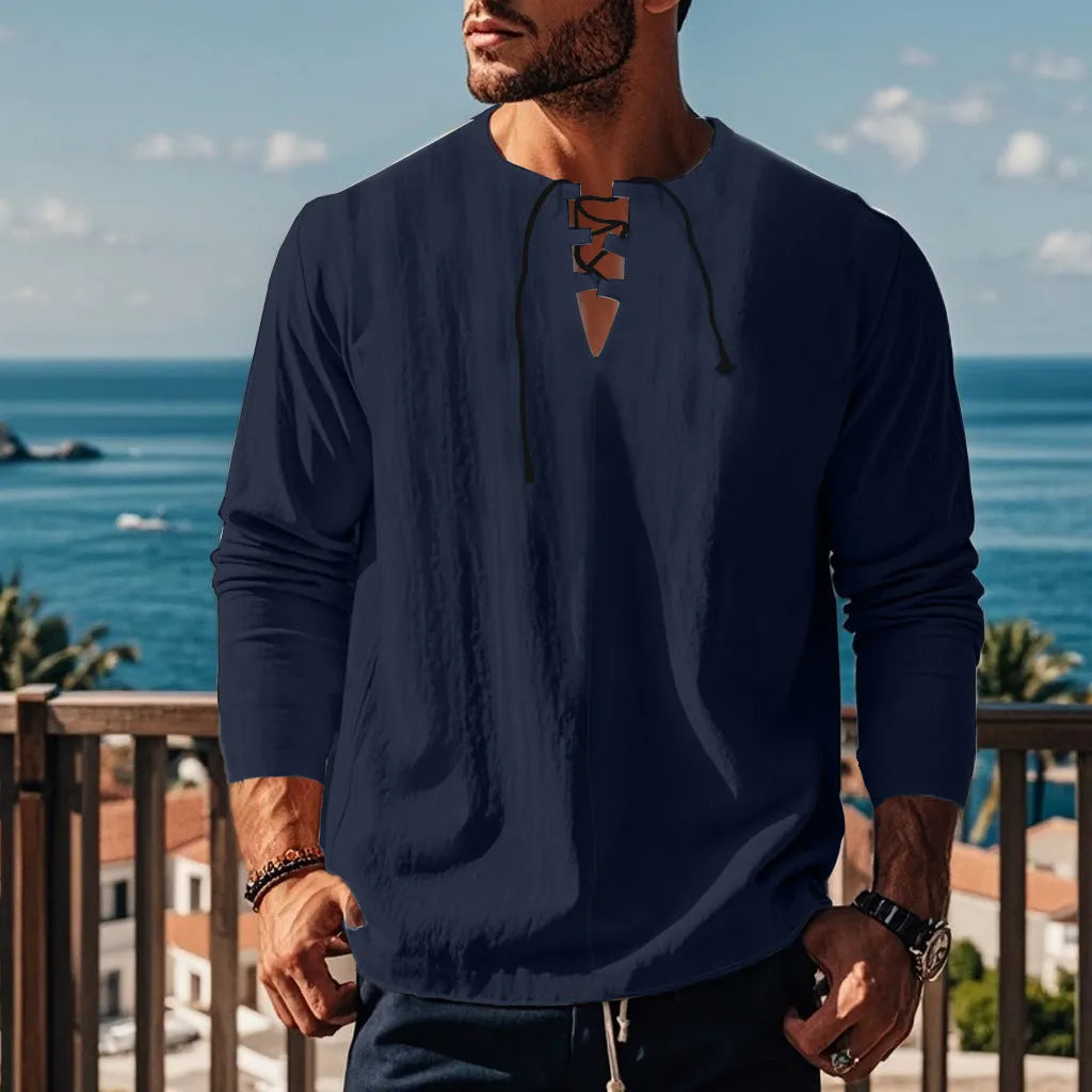 A man wearing a loose-fit solid colour cotton linen blend casual shirt.