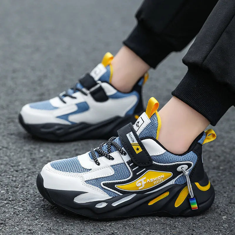 Boys' dark blue and black sports running shoes with velcro strap and mesh upper.