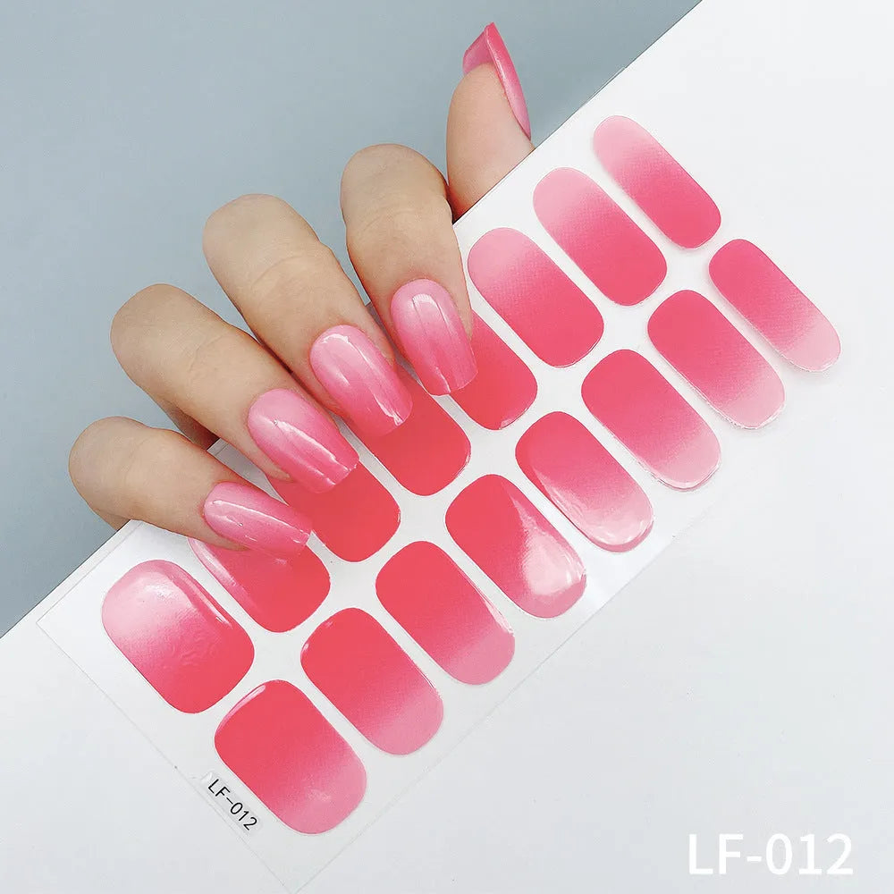 Set of 16 solid colour nail art stickers showing floral, geometric, and pattern designs for manicure application
