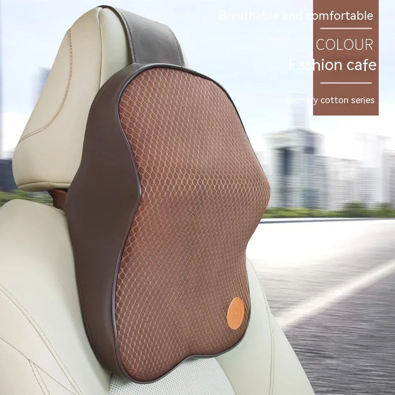 Black and brown memory foam car headrest and lumbar support pillows on a car seat.