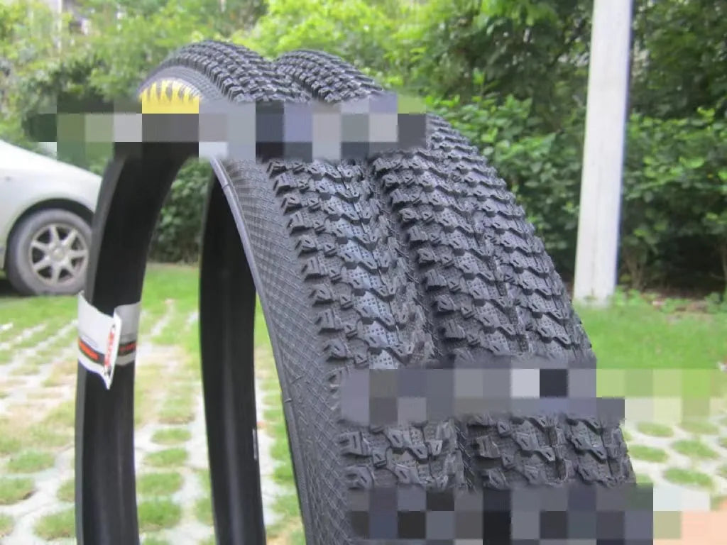 Ultralight mountain bike tyre with tread pattern shown, available in multiple sizes including 26, 27.5 and 29 inch diameters.