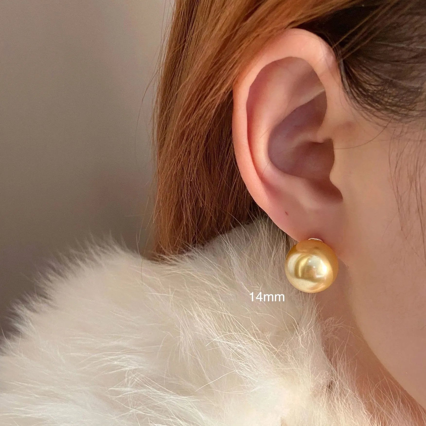 Women's large pearl stud earrings with an eight-pointed star geometric setting in sterling silver.