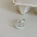 Geometric open ring with three-dimensional interlaced matte metal design in gold or silver electroplated finish