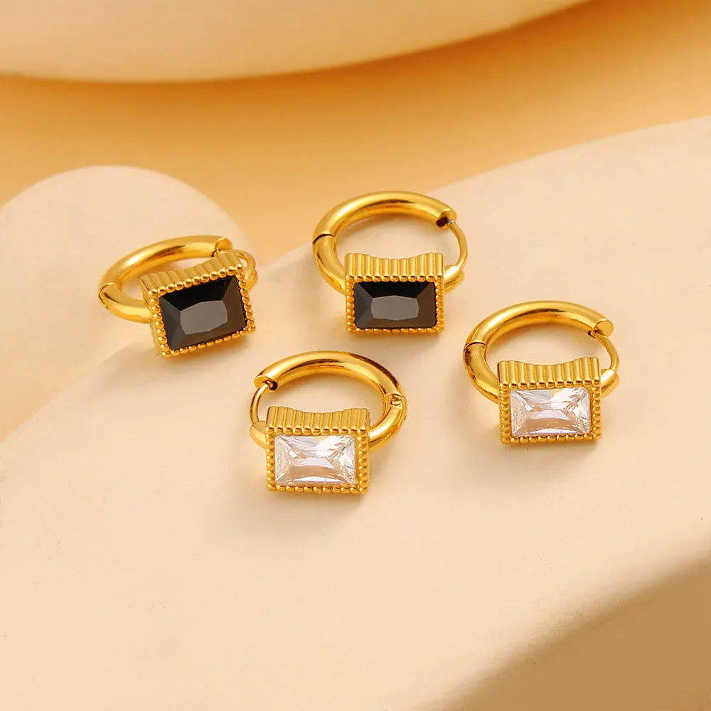 Square geometric design stainless steel earrings with zircon accents in white, black, and green colours.
