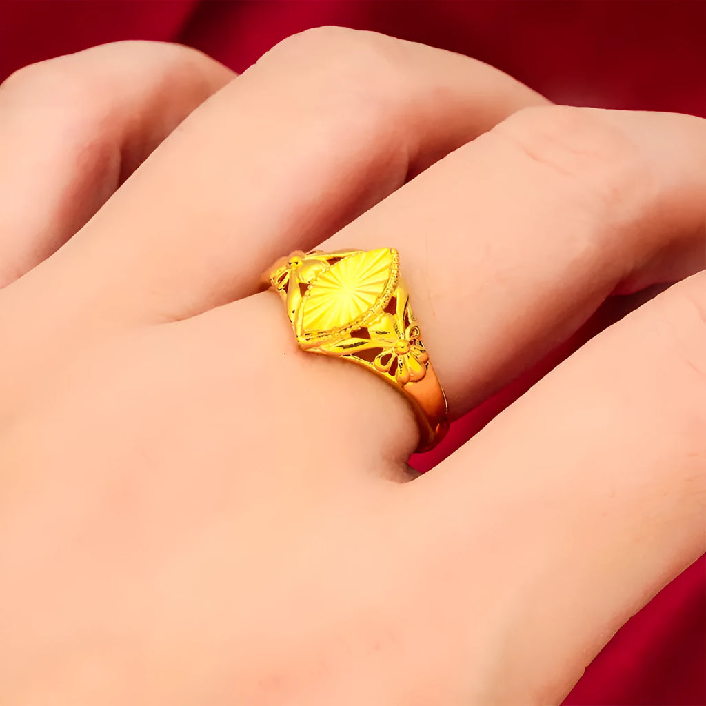 Gold electroplated brass flower ring with open geometric design and textured alluvial pattern