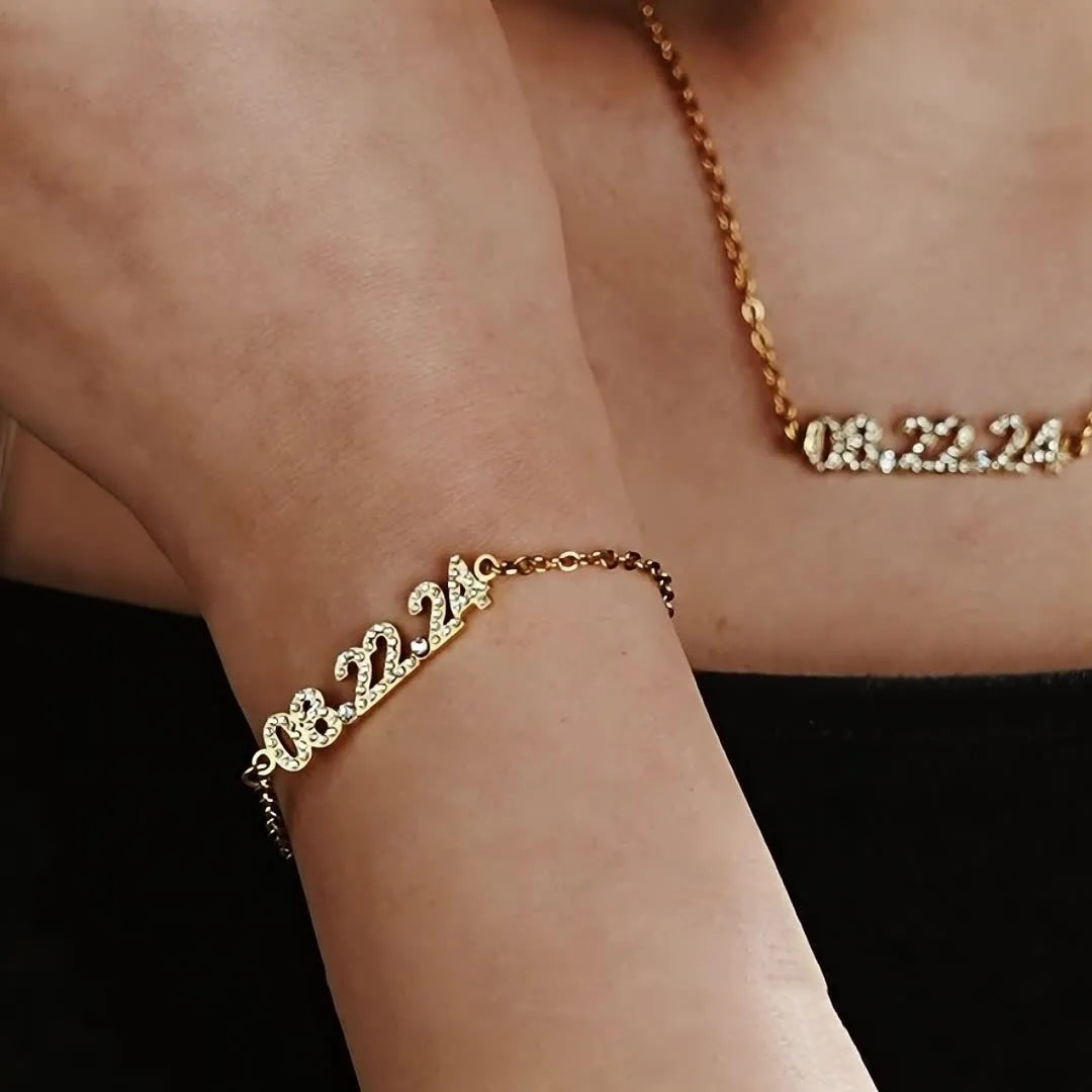 Stainless steel digital bracelet with diamond-set numbers on display, shown in a gold tone finish.