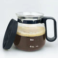 Transparent borosilicate glass coffee maker with a black silicone cover, showing 355-473 ml capacity.