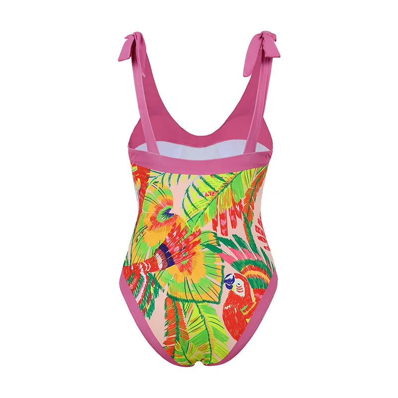Women's pink floral print one-piece swimsuit with V-neck, covered belly, and attached skirt for swimming