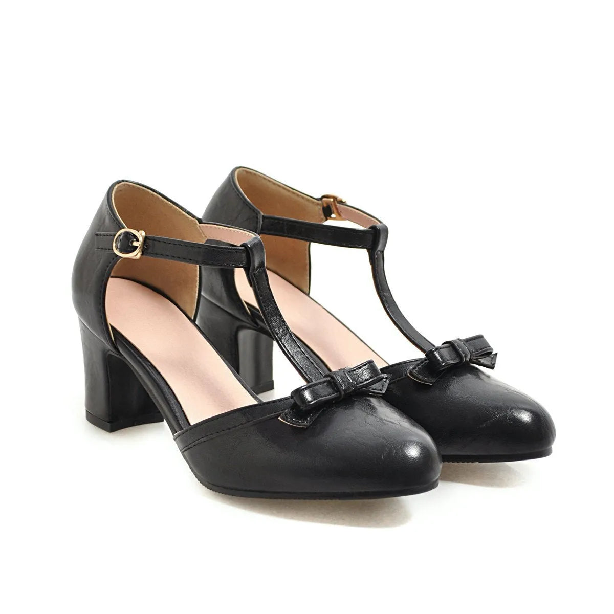Women's apricot coloured chunky heel sandals with a bow tie and adjustable buckle strap.