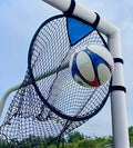 Portable black and yellow soccer training goal net set up on a grass field.