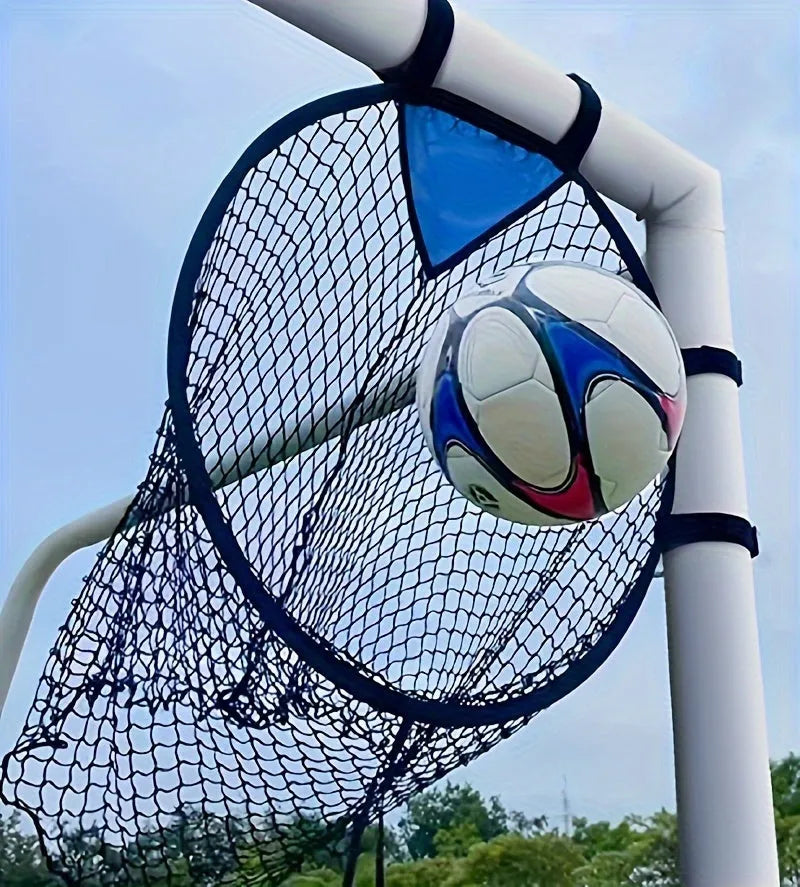 Portable black and yellow soccer training goal net set up on a grass field.