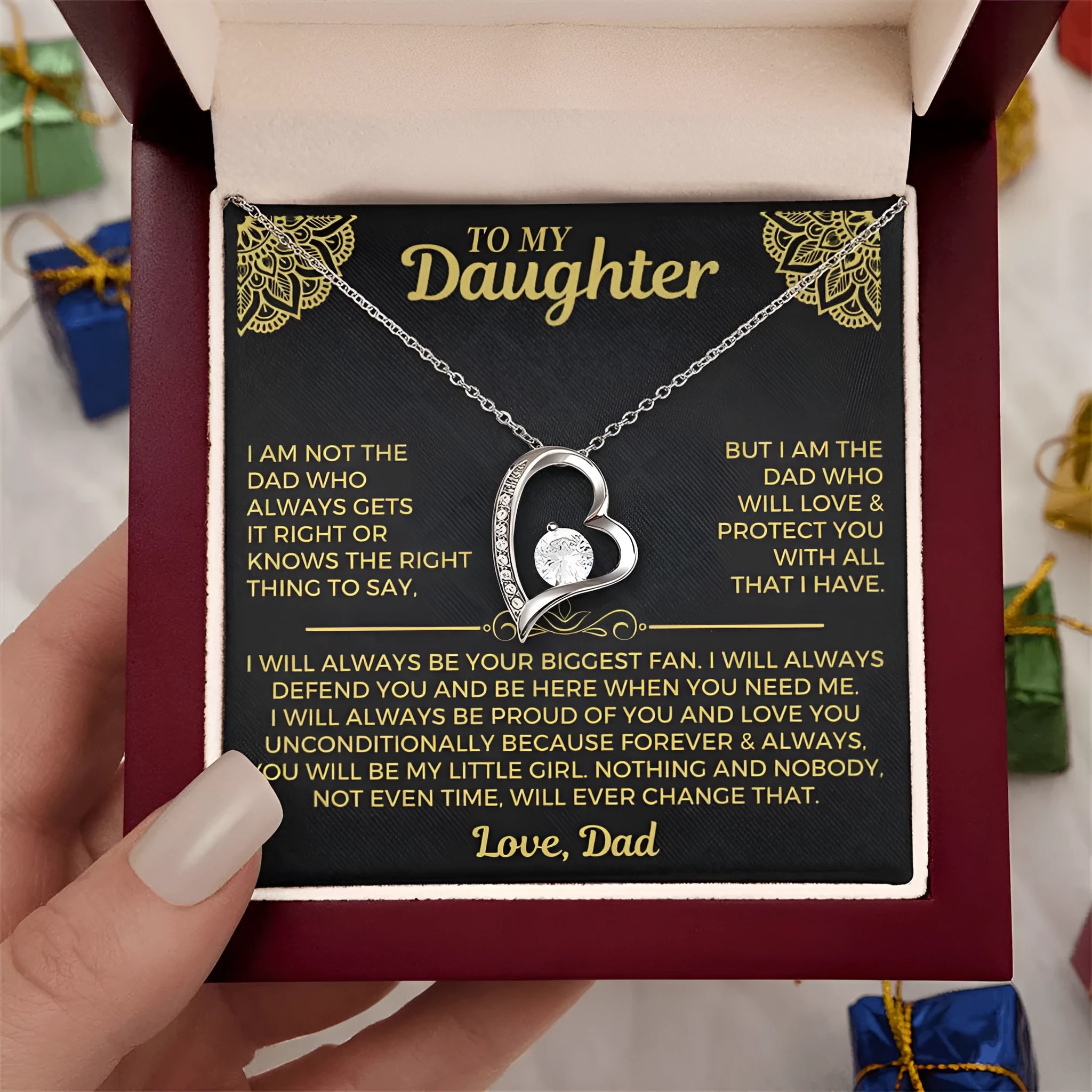 Gold hollow heart pendant necklace presented in an open flip gift box with a card.