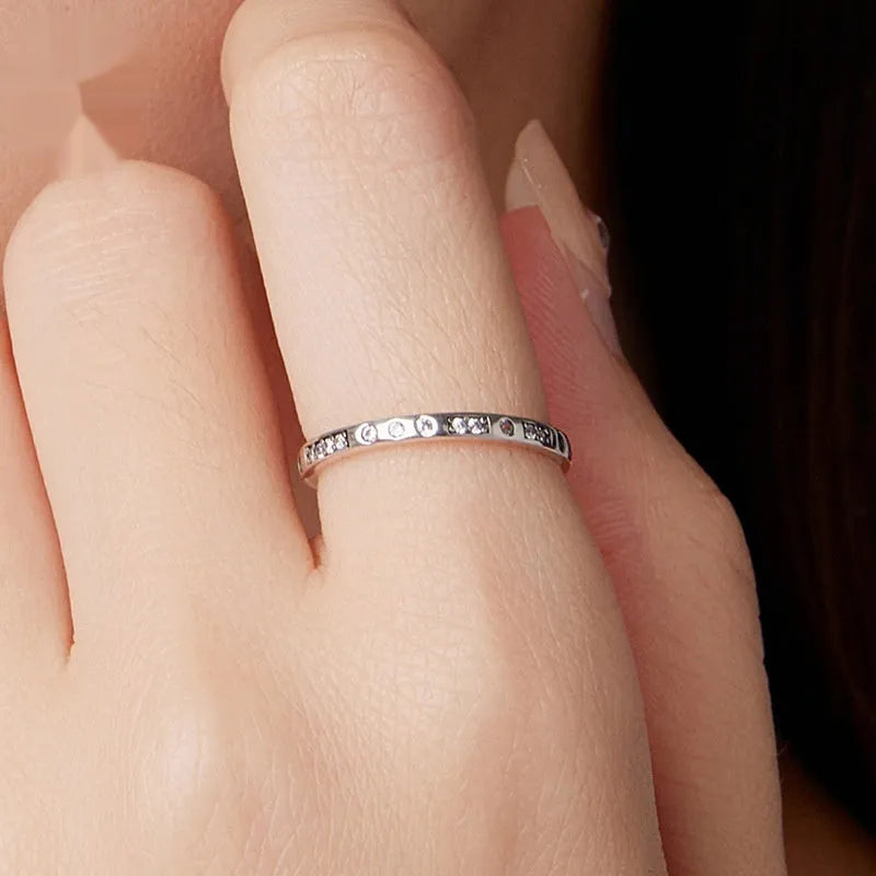 Moss Password black oxidised silver I Love You ring on a jewellery display.