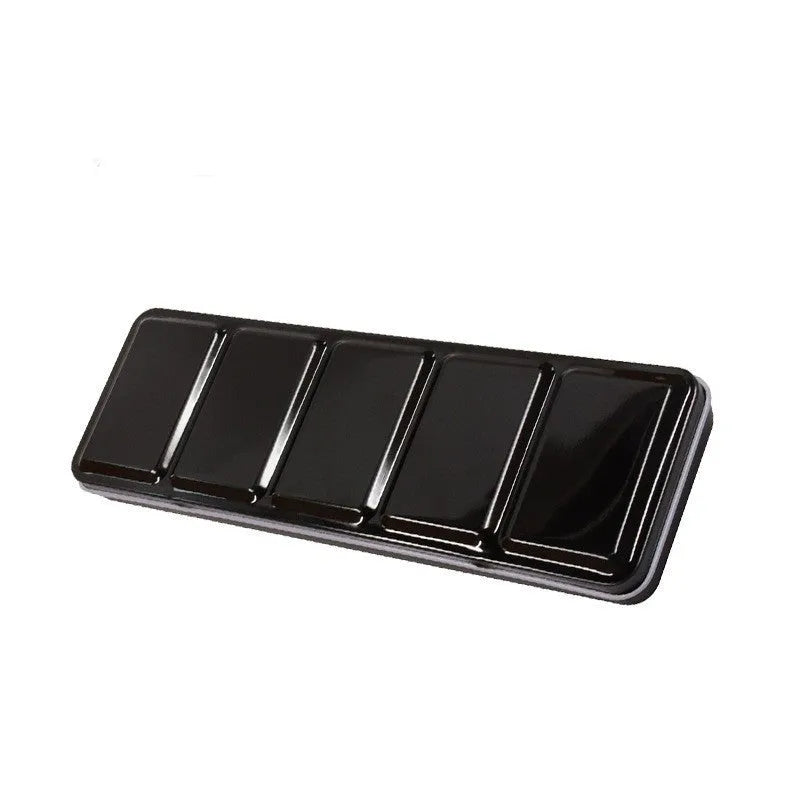 Square tinplate three-fold paint box for solid watercolours, shown open with empty slots.