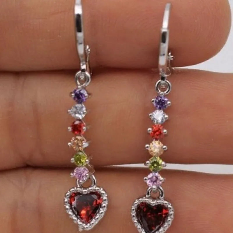 A pair of women's heart-shaped alloy earrings with an electroplated gold or silver finish.