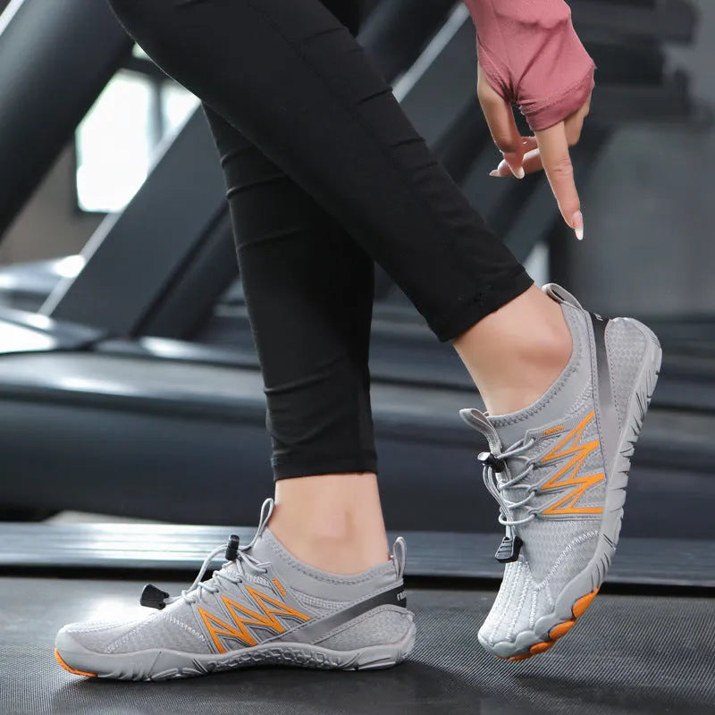 Lightweight indoor fitness training sneakers with low-top design and striped pattern.