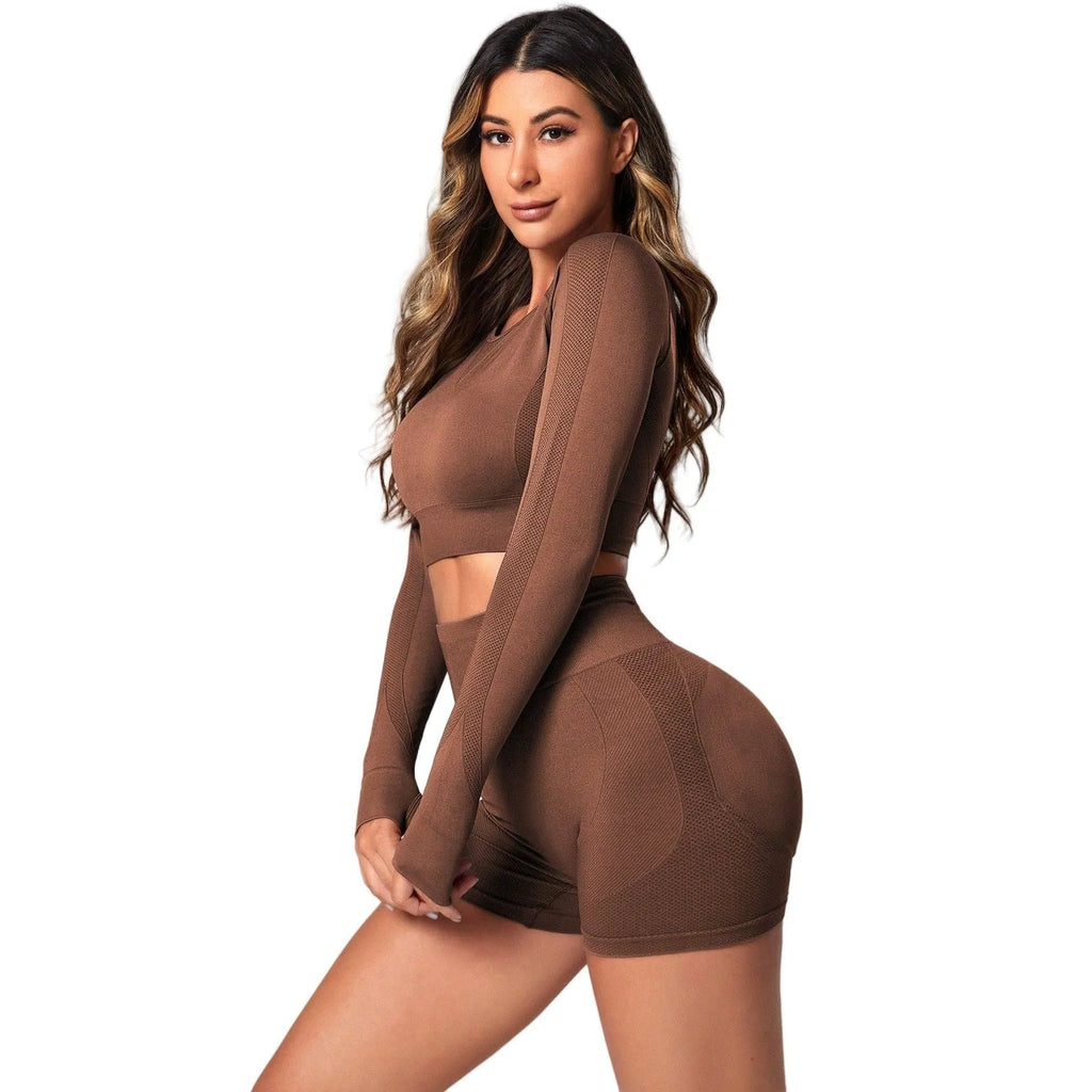 Women's black high-waisted yoga suit set with long sleeves and tight fit