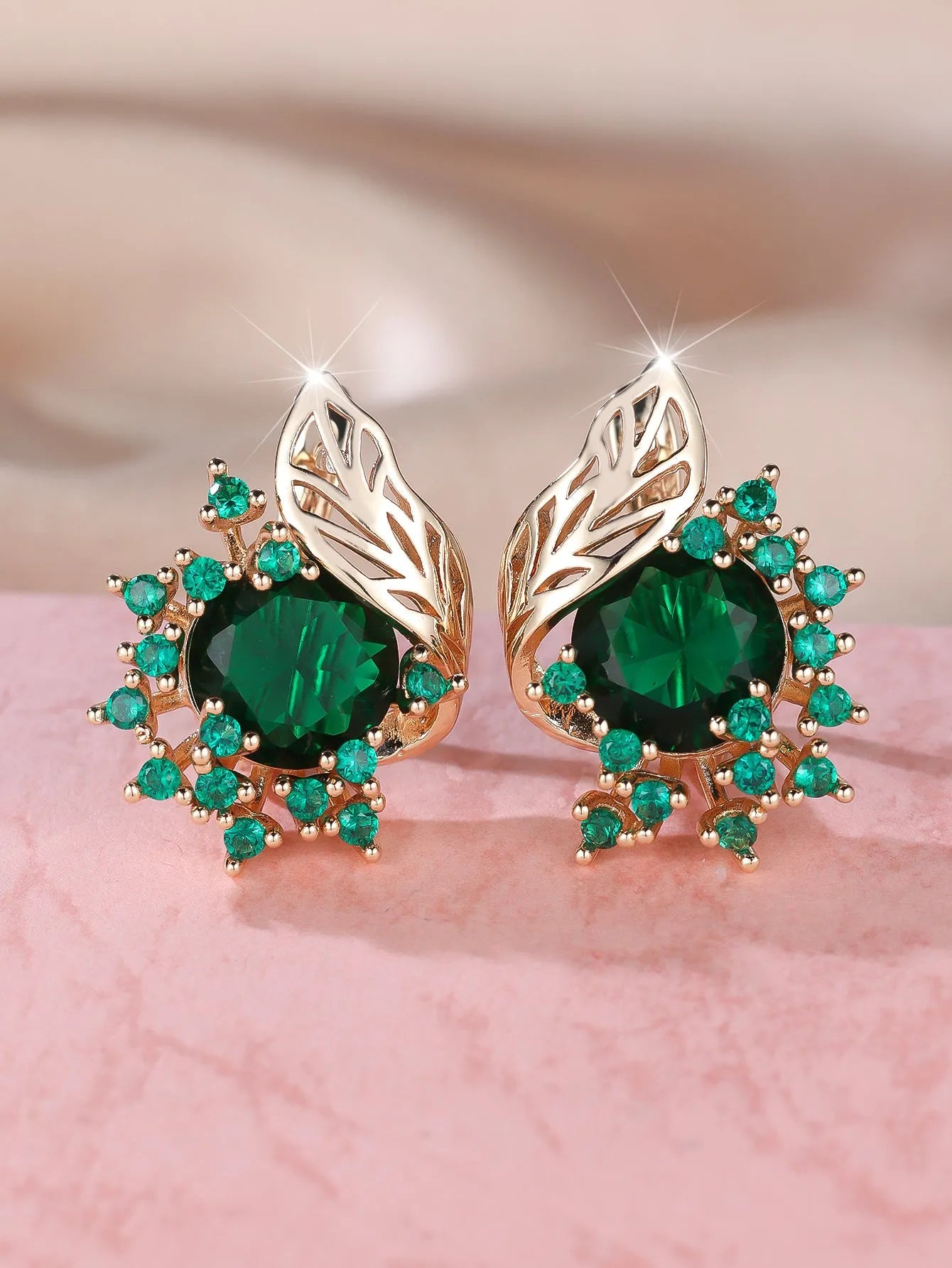 Round floral earrings with feather detailing and coloured zircon stones in champagne gold finish