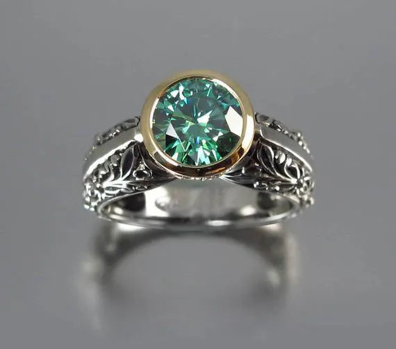 Gold-plated flower-shaped ring with vintage gemstone details in green silver colour