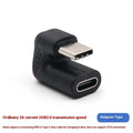 Set of four plastic USB male to female adapter extension cables with U-bend design on white background.