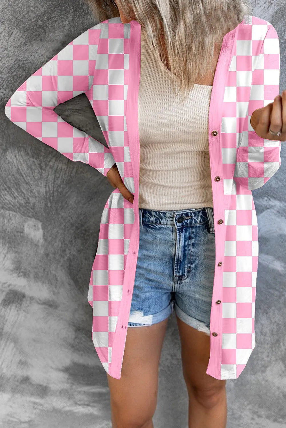 Women's long grey plaid pattern knitted cardigan coat with regular sleeves, shown on a model.