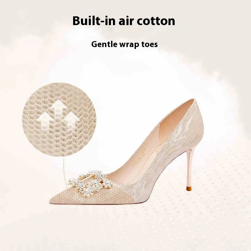 Champagne gold women's pointed-toe stiletto heels with rhinestone detail on the upper.