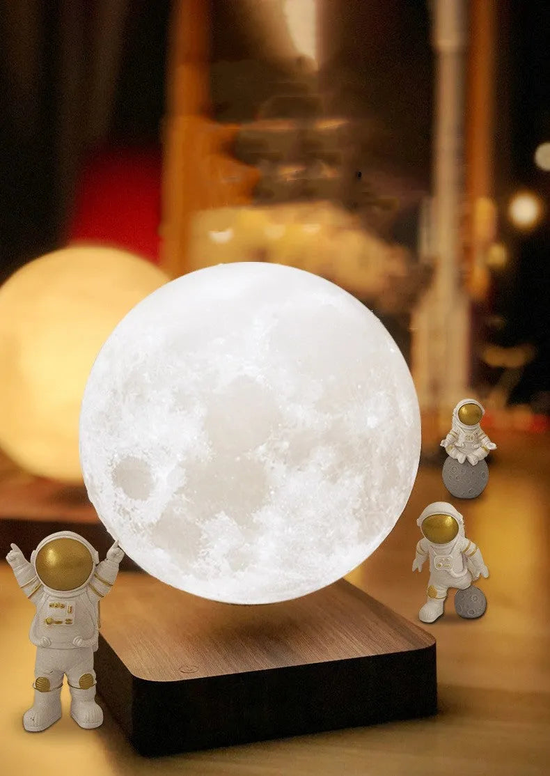 Maglev floating planet night light with LED glow, astronaut figurines, and USB cable.