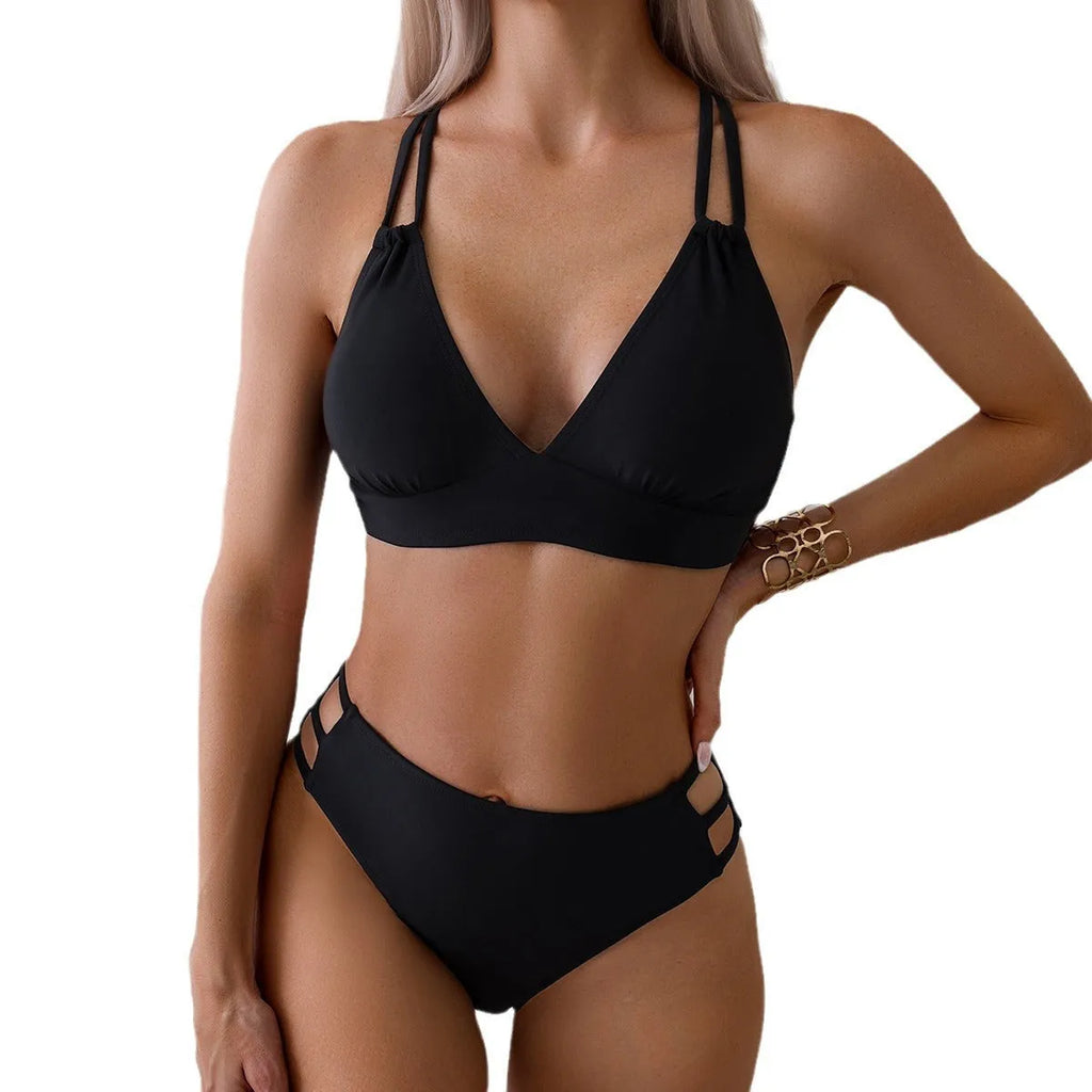 Women's black halter neck bikini swimsuit with V-neck top and split shorts on mannequin