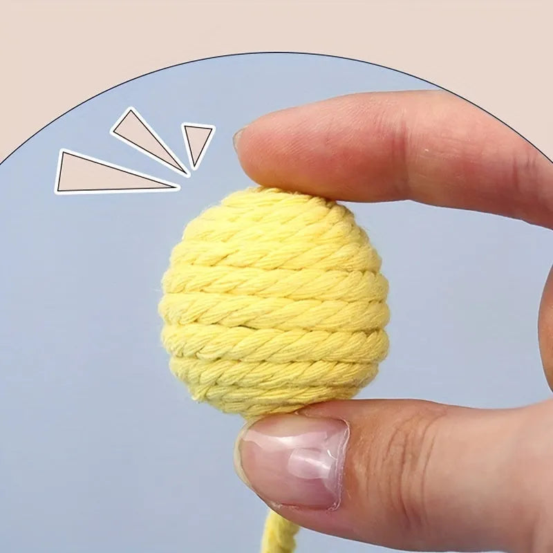 Colourful cat toy ball with rope handle and built-in bell for interactive play