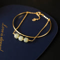 Women's Hetian jade lucky beads bracelet with gold inlay in single, double, and three-bead versions.