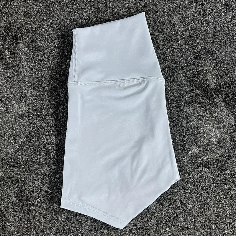 Ladies high-waisted yoga shorts in nylon fabric, shown in one of 16 available colours.